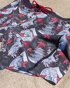 Stylish Men’s Board Shorts with 4-Way Stretch Technology on sand background detailed close up