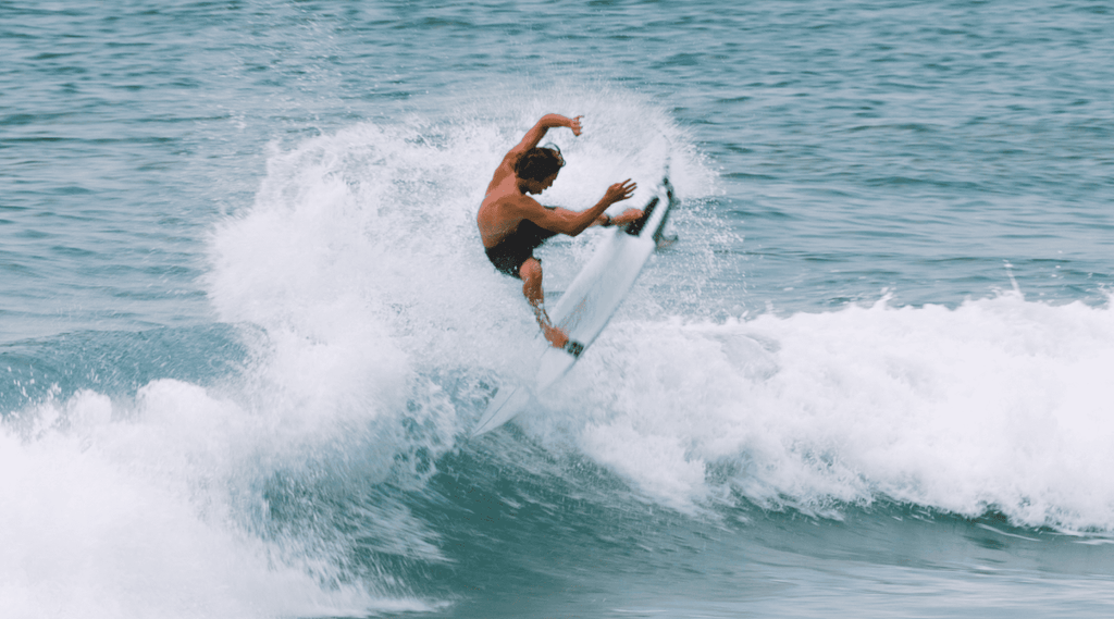 Ryan Risko in water surfing action shot