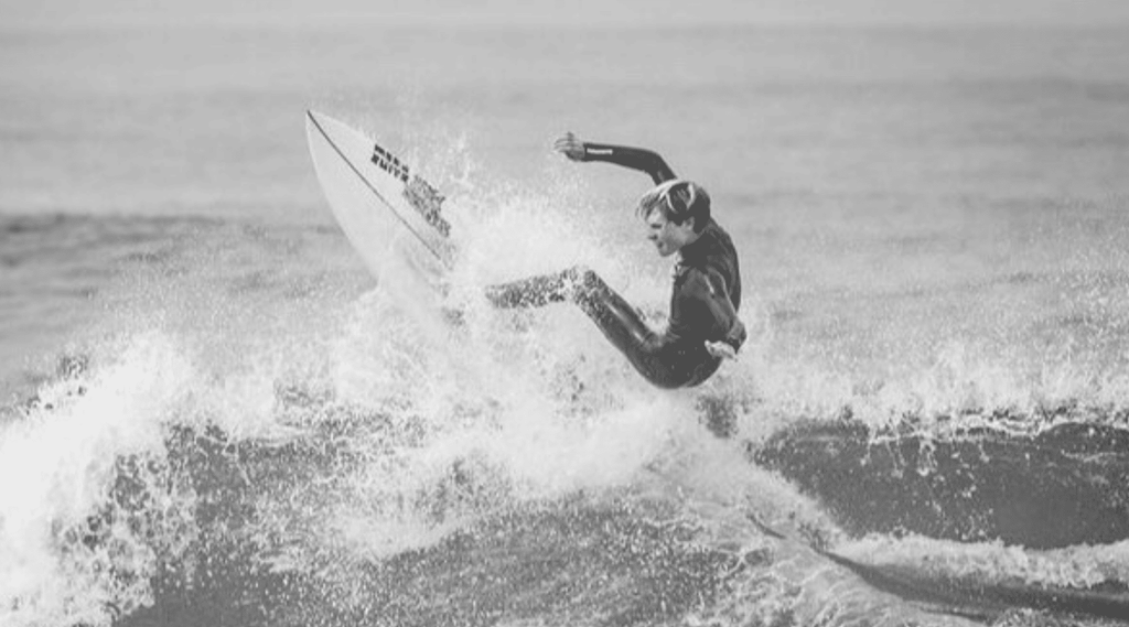 Sutton Tudor in water surfing shot