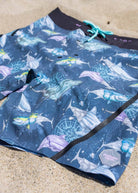 Men’s Navigator 4-Way Stretch Printed Board Shorts for beachwear close up detailed photo on sand