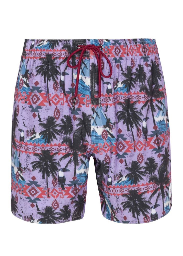 Front view of Psycho Tuna’s Men’s Aztec Paradise Printed Pool Shorts in Purple Rose color, displaying the striking Aztec design against a serene sunset hue