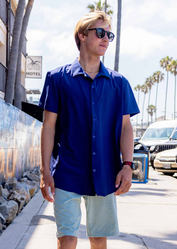 On model front view of the Men’s Cruiser Coconut Woven Shirt in Naval Academy color, reflecting the spirit of the cruiser lifestyle